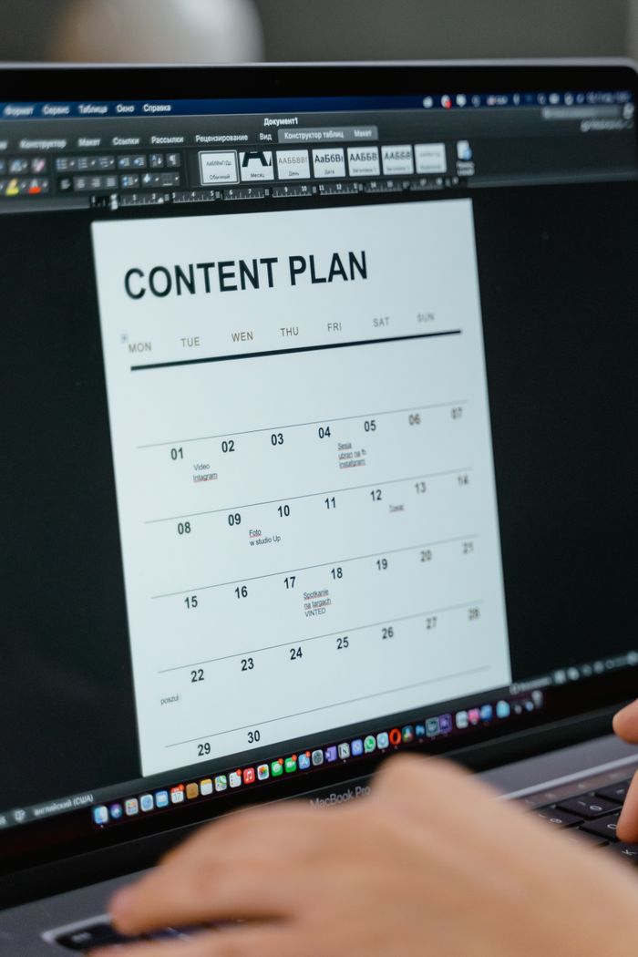 our-story-02 Close-up of digital content plan on laptop screen, ideal for scheduling visuals.